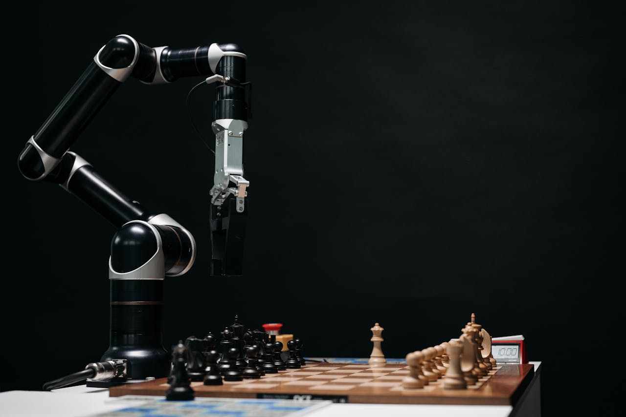 A robotic arm engages in a chess match, showcasing AI and robotics in a studio setup.